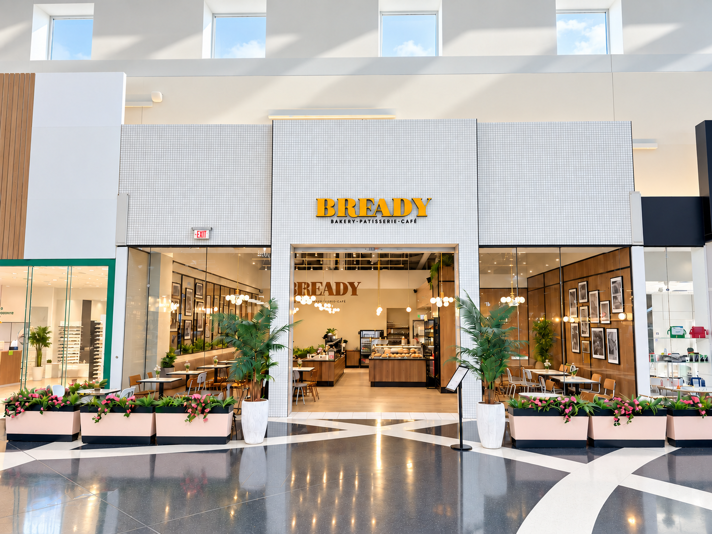 Bready Vaughan Mills storefront — blush planters and glowing globe lights